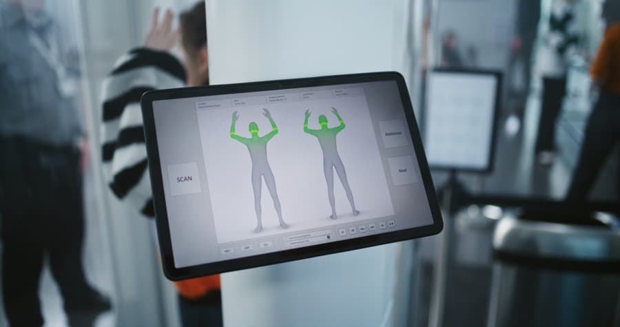 Airport body scanner at a TSA security checkpoint, representing the scanners our family opted out of during travel.